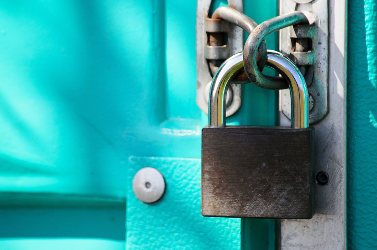 a closed door with a locked padlock